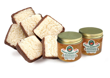 Two jars of handcrafted Florida marmalade with coconut patties included in this deluxe citrus gift